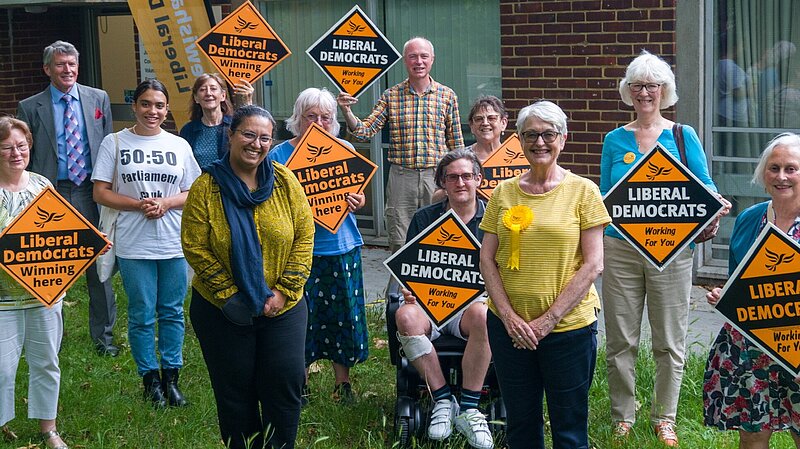 A picture of Lewisham LibDem members with Hina Bhokari AM. The picture includes a wheelchair user and a woman of colour wearing a 50:50 parliament t-shirt.