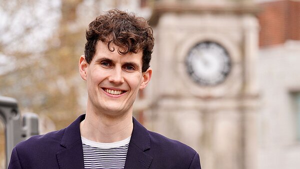 Josh at the clock in Lewisham Town Centre
