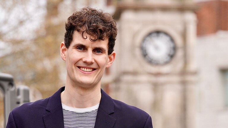 Josh at the clock in Lewisham Town Centre