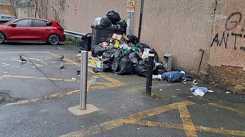 Flytipping with loads of rubbish in car park area