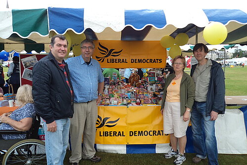 Chris Maines with other members in front of a Lib Dem stall at Blackheath fete